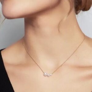 minimalist gold chain necklace with triple pearl detail