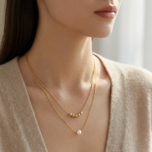 elegant layered gold necklace with pearl pendant